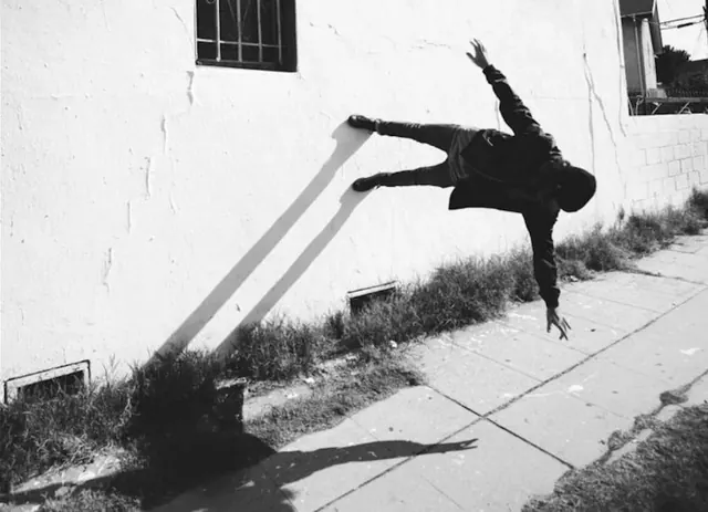 Gravity-Defying Figure Photograph, monochrome, brutalist, monochrome