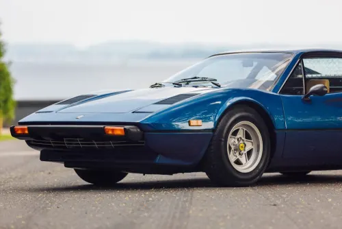 Blue Sports Car on Coastal Road, photographic, retro, vibrant