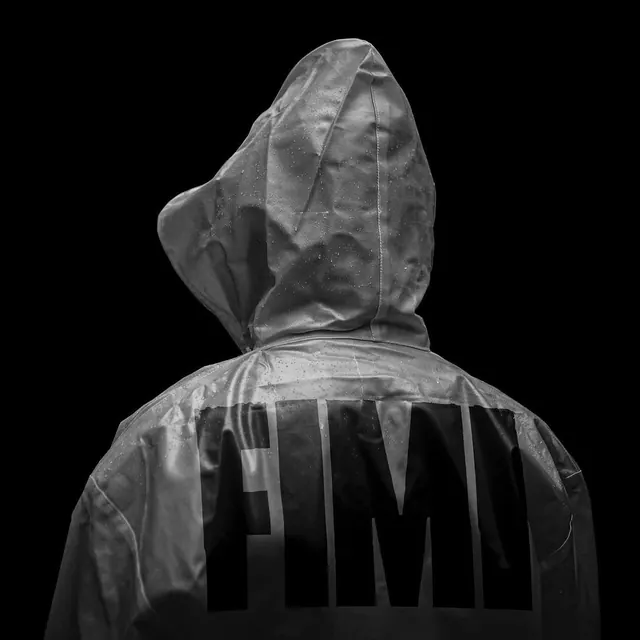 FIMI wet raincoat back portrait, monochrome, editorial, monochrome