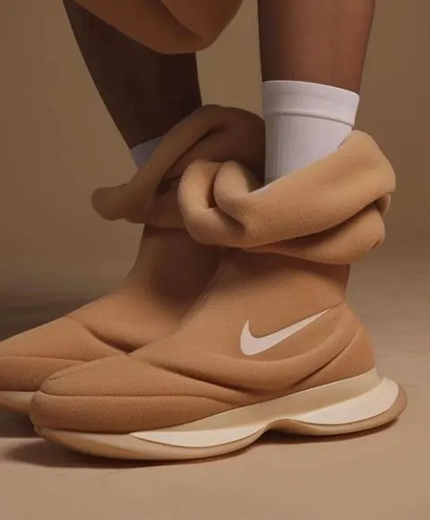 Tan Sculptural Nike Boot Close-Up, photographic, minimal, warm