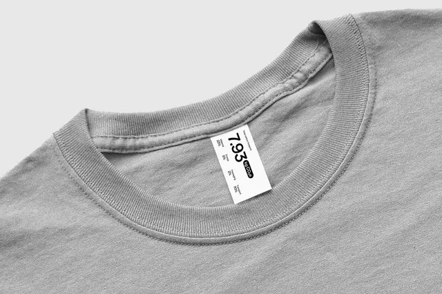 Carbon footprint garment tag, minimal, corporate-clean, monochrome