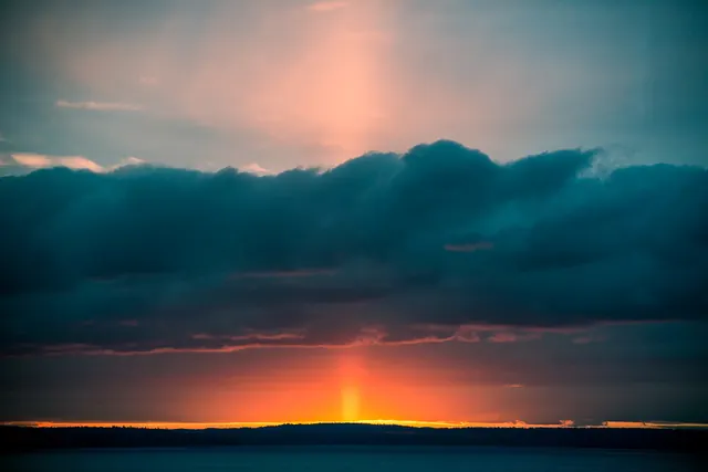 Sun pillar landscape photo, photographic, minimal, warm