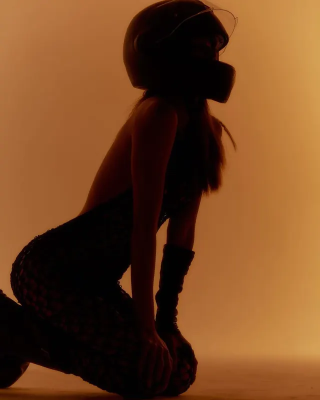 Helmet silhouette fashion portrait, editorial, photographic, warm