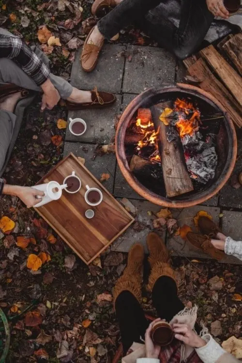 Autumn fire pit tea gathering, organic, photographic, warm