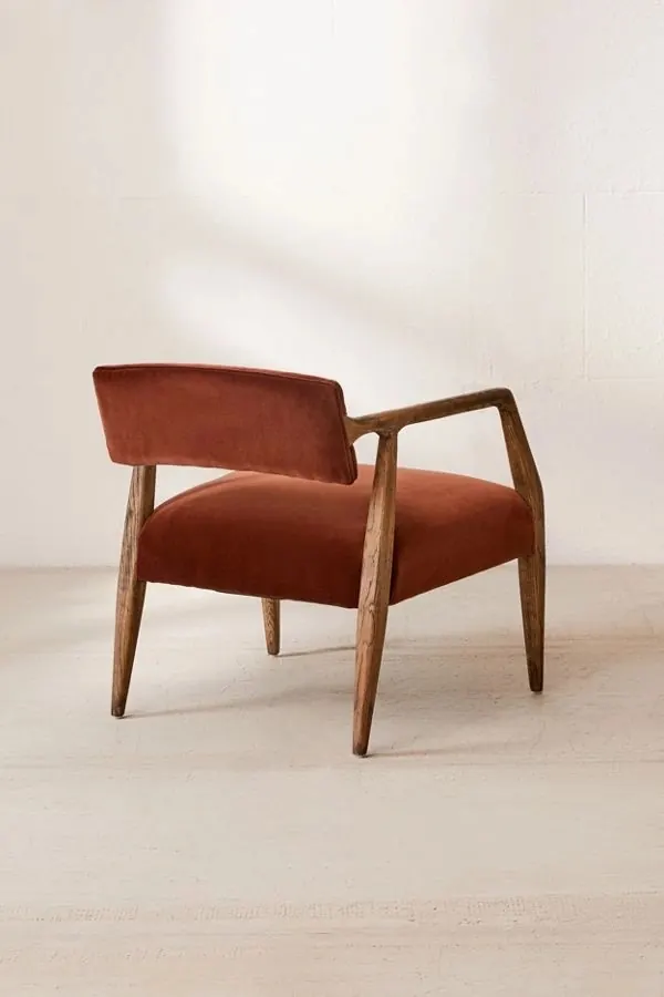 Rust velvet mid-century lounge chair, minimal, organic, warm