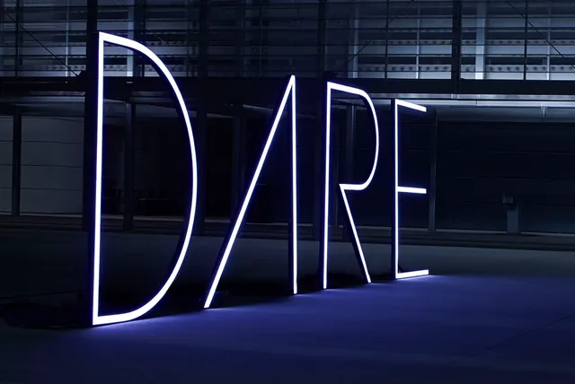 DARE neon tube letter installation, minimal, technical, dark