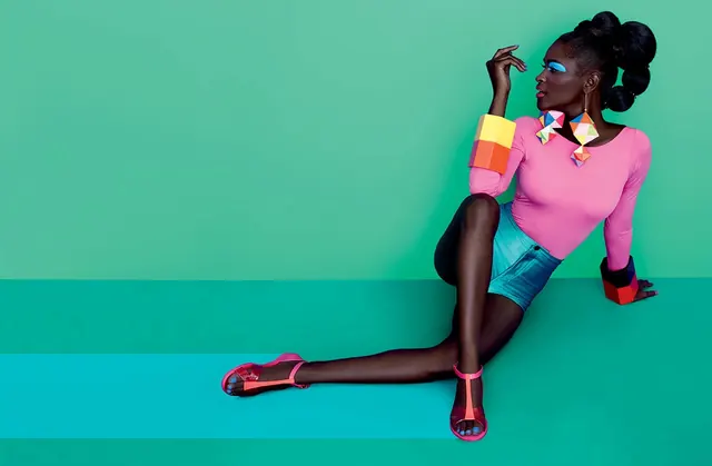 Color-block fashion editorial on green, photographic, maximalist, vibrant