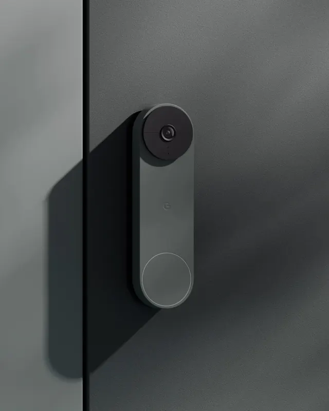 Nest doorbell on textured wall, minimal, photographic, muted