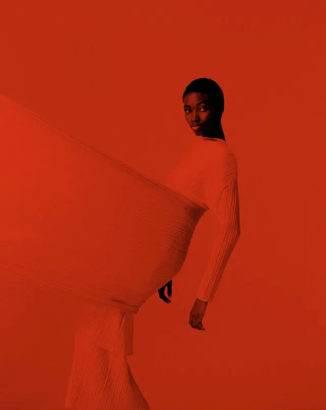 Red pleated fabric fashion sculpture, editorial, photographic, vibrant