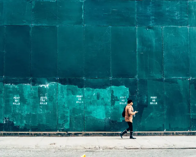 Person Walking Past Teal Wall, minimal, brutalist, cool