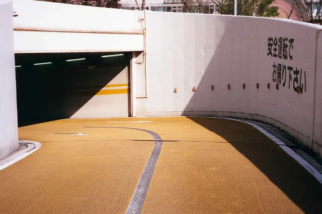 Parking Garage Entrance with Text Overlay, minimal, brutalist, warm