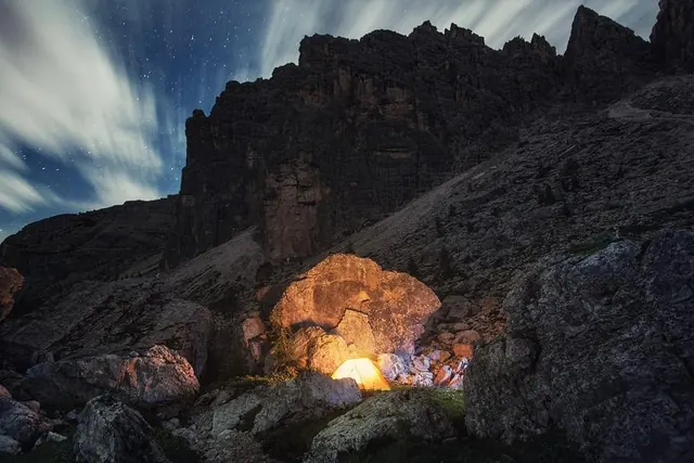 Glowing Cave Entrance at Night, photographic, dark-mode, dark