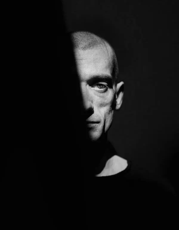 Half-shadow portrait study, editorial, photographic, monochrome