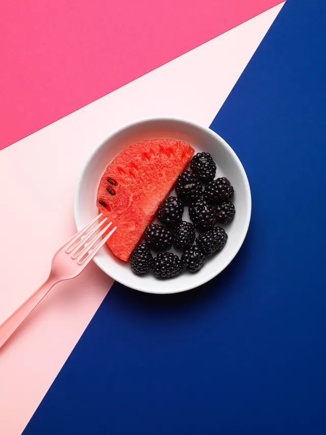 Geometric fruit bowl flat lay, minimal, photographic, vibrant