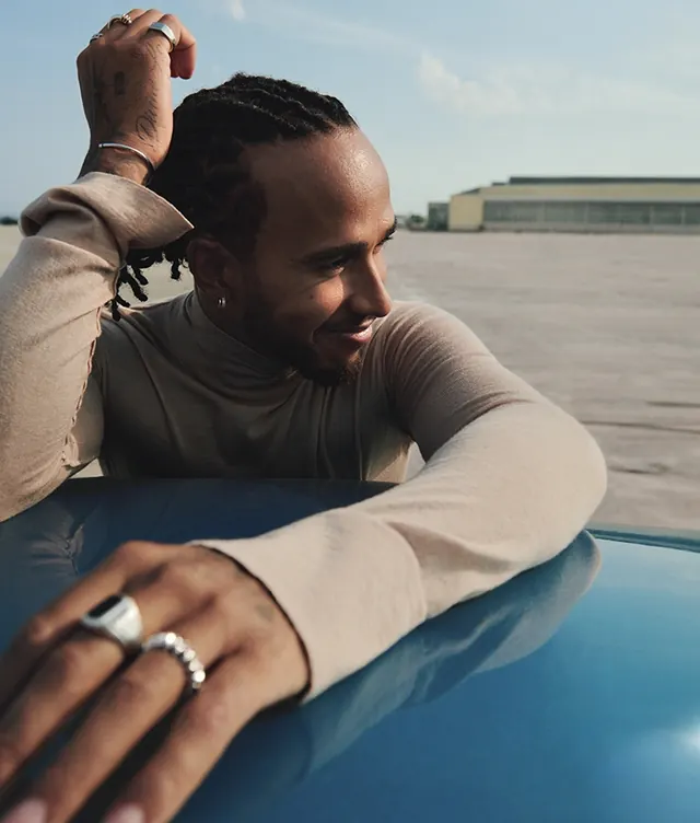 Lewis Hamilton portrait on car hood, photographic, minimal, light