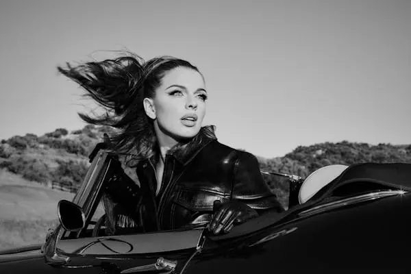 Woman in convertible black and white, photographic, retro, monochrome