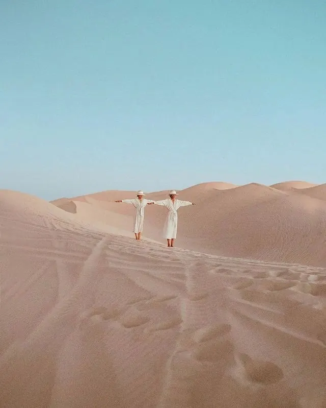 Twin Figures on Sand Dunes, editorial, photographic, light