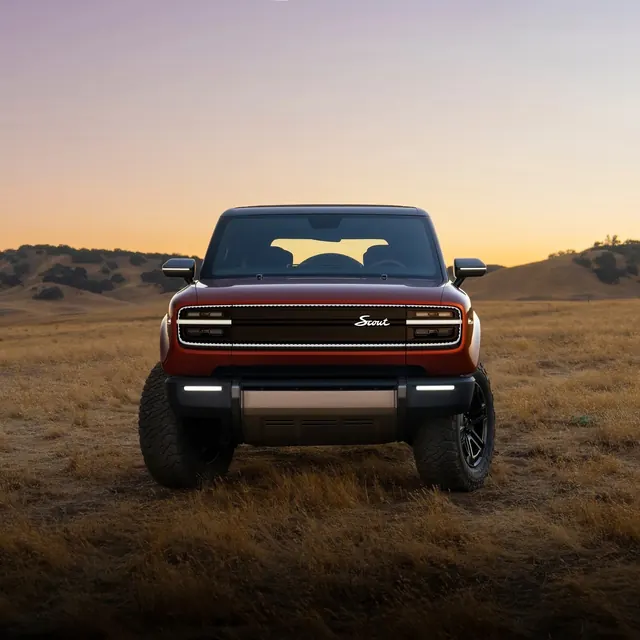 Scout SUV golden-hour reveal, photographic, minimal, warm