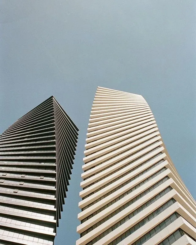 Twisting towers worm's-eye view, minimal, photographic, cool