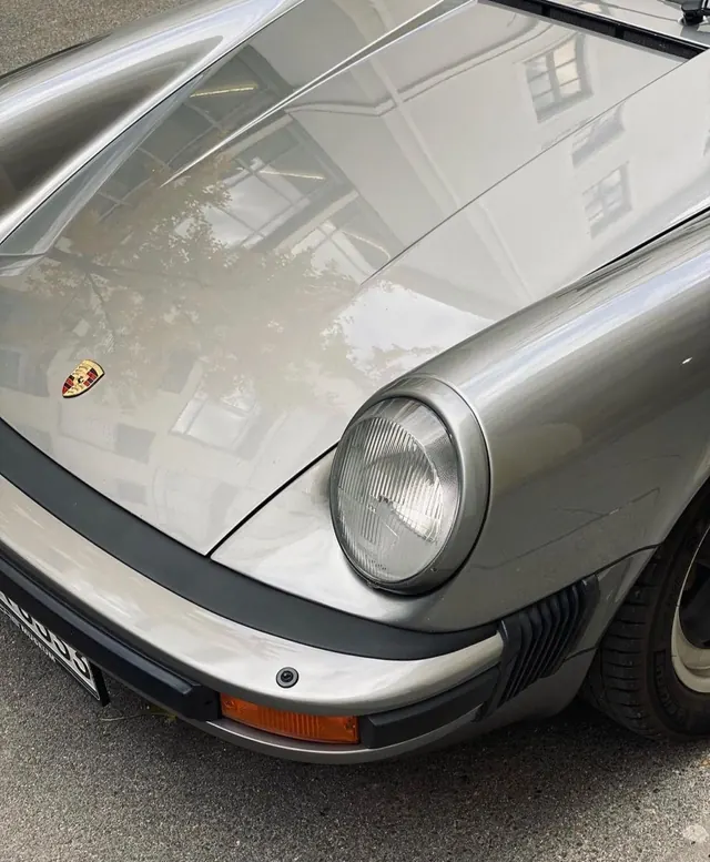Silver Porsche 911 front detail, minimal, photographic, light