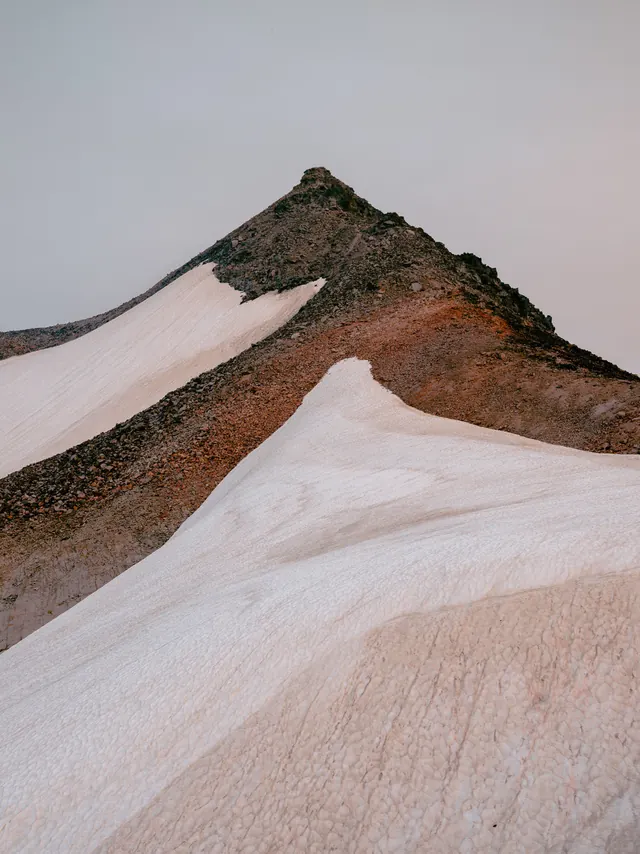 Snowy mountain peak landscape, minimal, photographic, muted