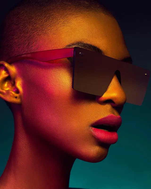 Gel-lit shield sunglasses fashion portrait, editorial, photographic, vibrant
