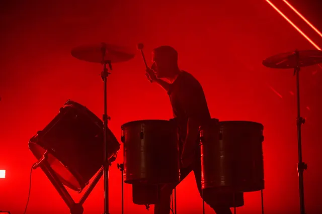 Live Drum Performance in Red Light
