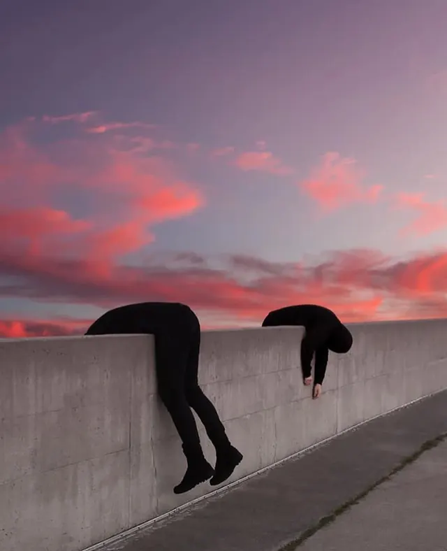 Silhouetted Figures Against Sunset