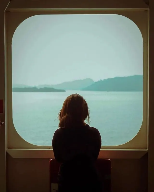 Person Looking Out Window