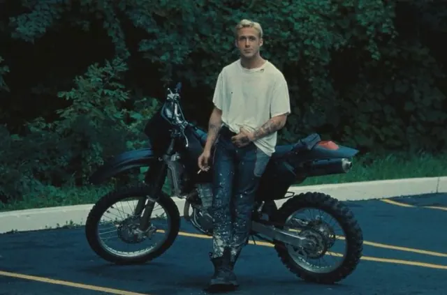 Man with Motorcycle in Forest