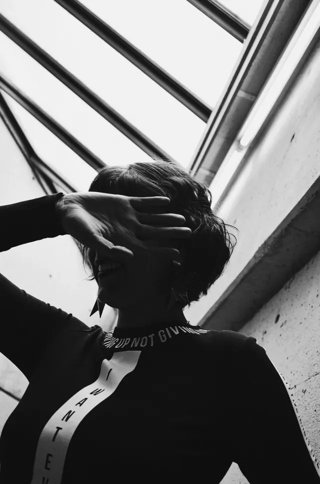 Monochrome Portrait with Architectural Shadows