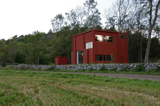 Red Modular Building in Forest