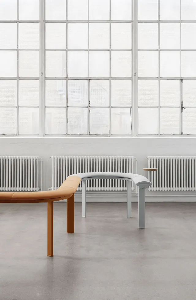Minimalist curved seating system in bright gallery, minimal, light-mode, light