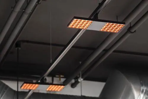 Industrial ceiling with warm LED light fixtures, minimal, dark-mode, dark
