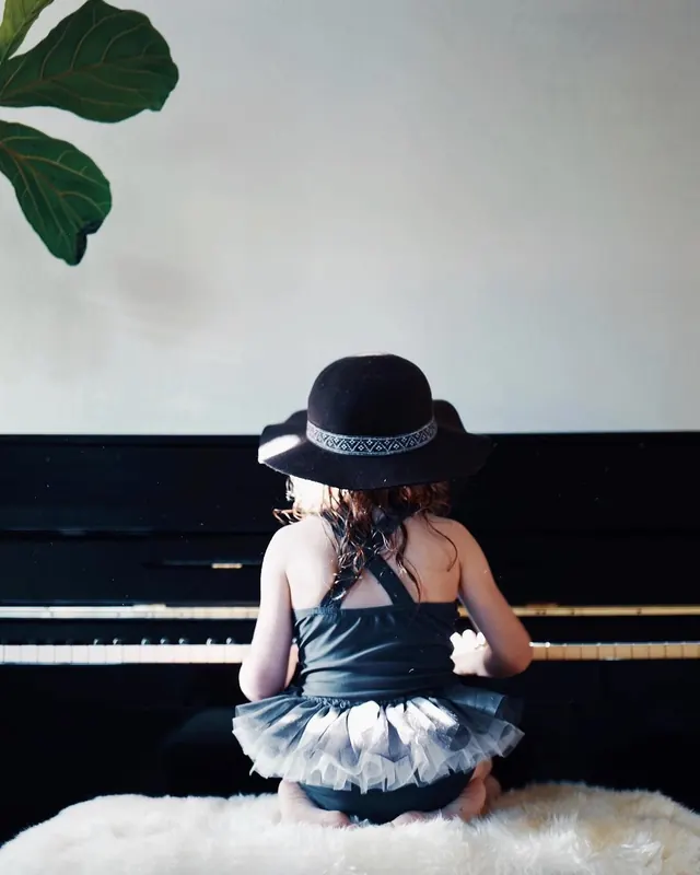 Child in Black Hat Portrait