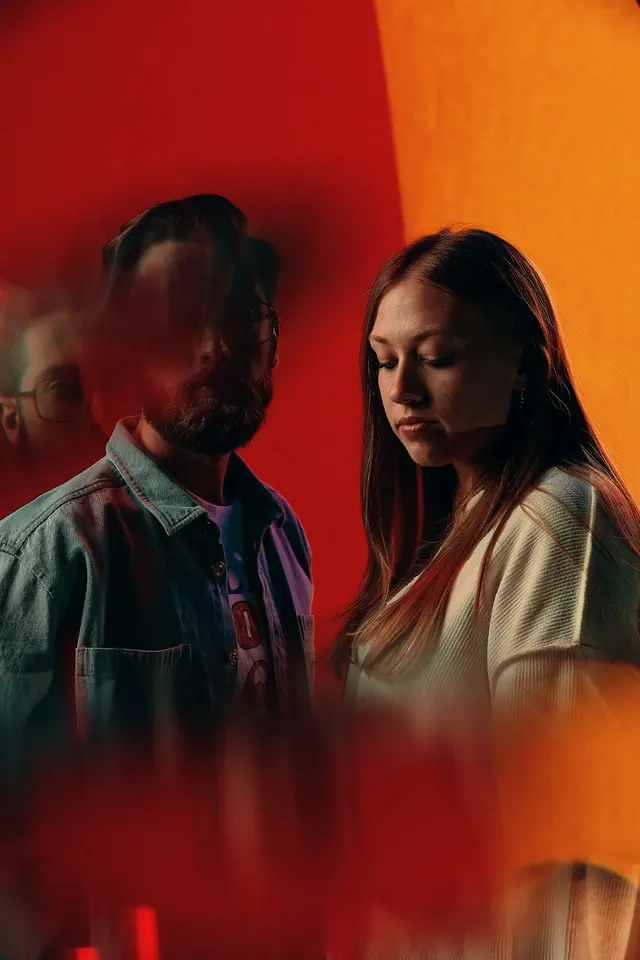 Portrait of Two Figures in Red Light