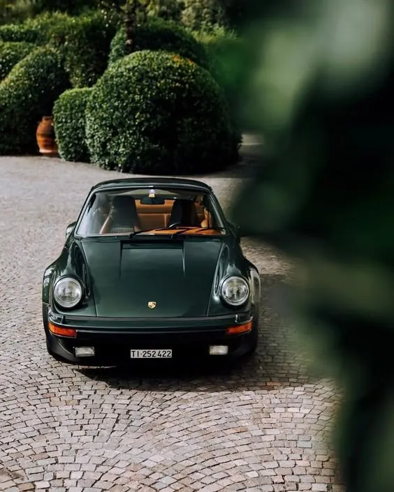 Vintage Car on Cobblestone Street