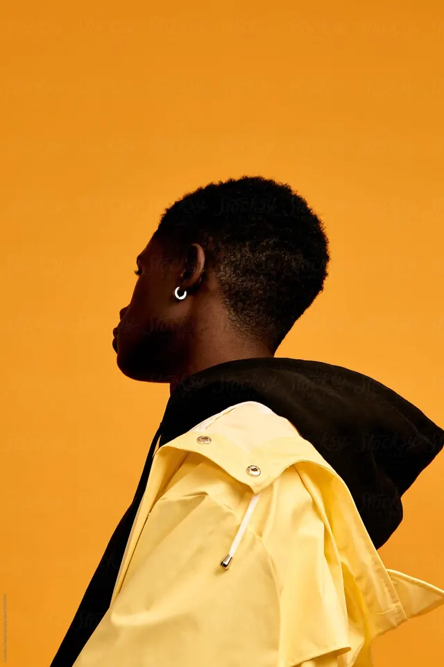 Portrait of a person in yellow and black apparel