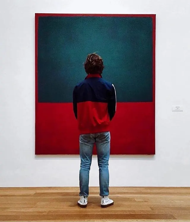 Person viewing large abstract painting