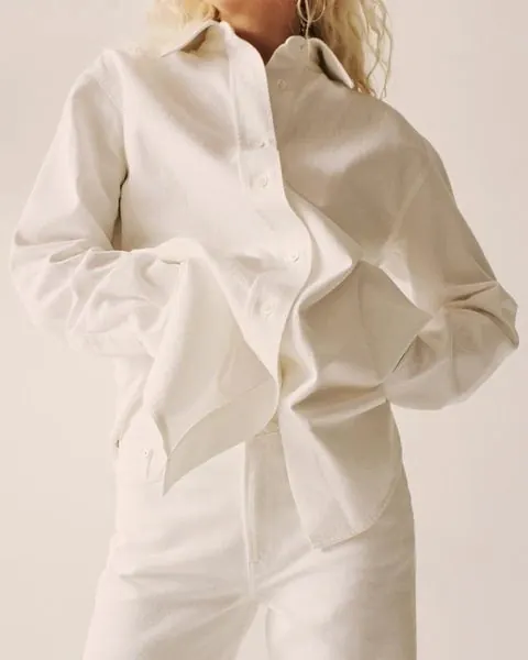 Oversized white linen shirt and trousers, minimal, photographic, light