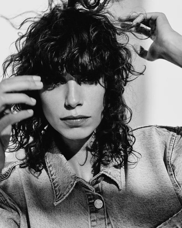 Monochrome Portrait of a Person with Curly Hair