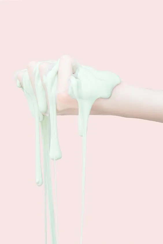 Hand Squeezing Light Green Slime, minimal, photographic, light