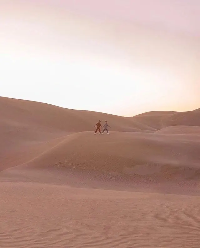 Couple Walking in Sand Dunes, minimal, photographic, warm