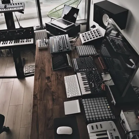 Music production desk with synthesizers, minimal, technical, dark