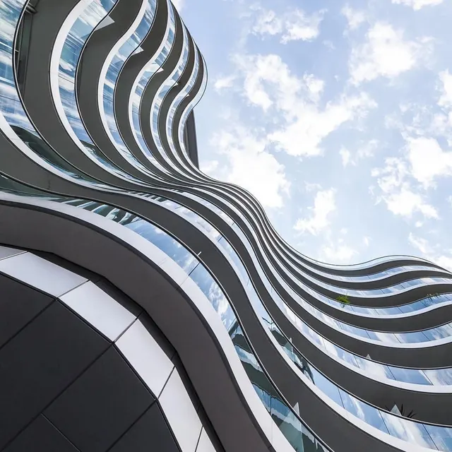 Wavy modern building facade, minimal, geometric, light
