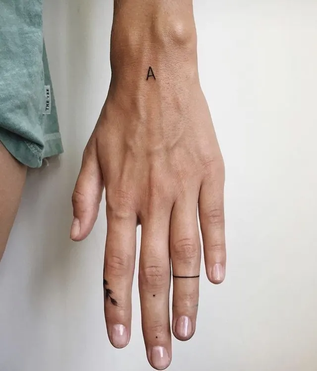 Hand with Minimalist Tattoos