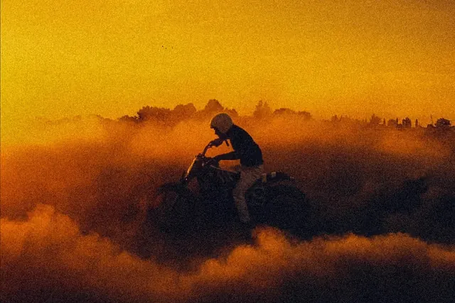 Motorcyclist in Golden Mist