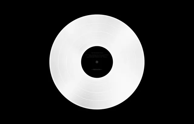 White Vinyl Record on Black Background