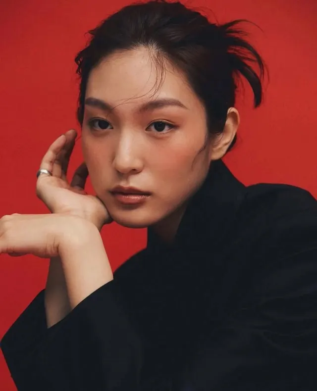 Portrait of a woman in red and black
