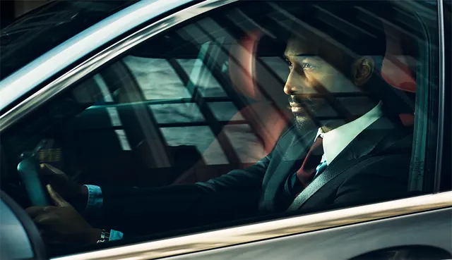 Man in Suit in Car
